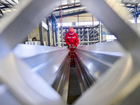 A worker works at a gas purification equipment manufacturing company in Qingzhou Economic Development Zone in Qingzhou, China, on November 9...