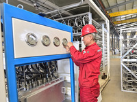 A worker works at a gas purification equipment manufacturing company in Qingzhou Economic Development Zone in Qingzhou, China, on November 9...