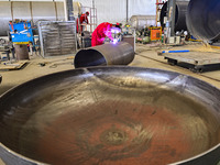 A worker works at a gas purification equipment manufacturing company in Qingzhou Economic Development Zone in Qingzhou, China, on November 9...