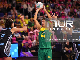 Dravyn Lee-Tauroa of Australia (C) shoots during the Fast5 Netball World Series match between New Zealand and Australia at the Wolfbrook Are...