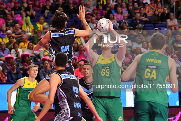 Liam Killey of Australia (second from right) shoots a goal during the Fast5 Netball World Series match between New Zealand and Australia at...