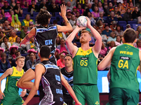 Liam Killey of Australia (second from right) shoots a goal during the Fast5 Netball World Series match between New Zealand and Australia at...