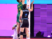 Alastair Punshon of Australia shoots a goal during the Fast5 Netball World Series match between New Zealand and Australia at the Wolfbrook A...