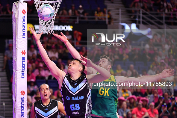 Mikaira Raerino of New Zealand and Alastair Punshon of Australia compete in the Fast5 Netball World Series match between New Zealand and Aus...