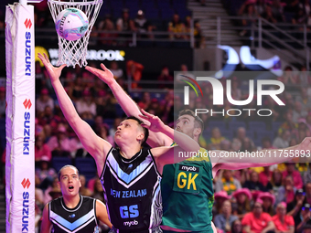 Mikaira Raerino of New Zealand and Alastair Punshon of Australia compete in the Fast5 Netball World Series match between New Zealand and Aus...