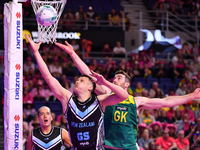 Mikaira Raerino of New Zealand and Alastair Punshon of Australia compete in the Fast5 Netball World Series match between New Zealand and Aus...