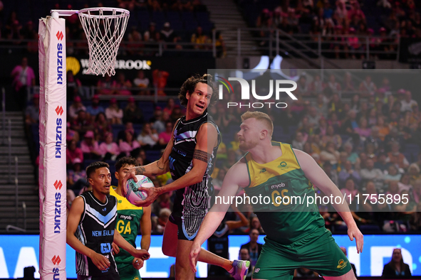 Timmy Apisai of New Zealand and Liam Killey of Australia compete in the Fast5 Netball World Series match between New Zealand and Australia a...