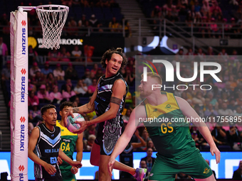 Timmy Apisai of New Zealand and Liam Killey of Australia compete in the Fast5 Netball World Series match between New Zealand and Australia a...