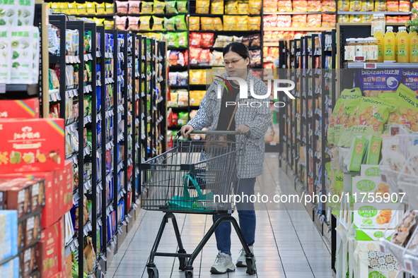 Customers shop for vegetables at a supermarket in Nanjing, China, on November 9, 2024. 