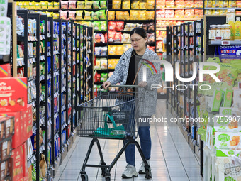 Customers shop for vegetables at a supermarket in Nanjing, China, on November 9, 2024. (