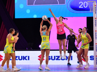 Kate Burley of New Zealand tries to block Reilley Batcheldor of Australia during the Fast5 Netball World Series match between New Zealand an...