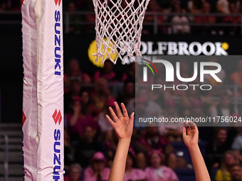 Martina Salmon of New Zealand (R) shoots during the Fast5 Netball World Series match between New Zealand and Australia in Christchurch, New...