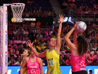 Teigan O'Shannassy of Australia (C) tries to block Saviour Tui of New Zealand during the Fast5 Netball World Series match between New Zealan...