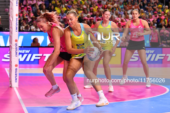 Matissa Letherbarrow of Australia (second from left) and Michaela Sokolich-Beatson of New Zealand (left) compete in the Fast5 Netball World...