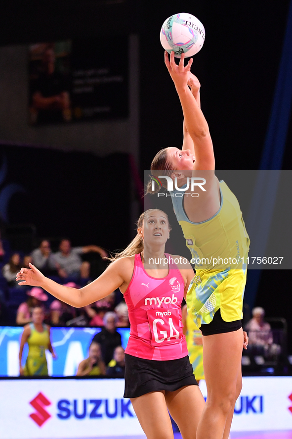 Lucy Austin of Australia and Martina Salmon of New Zealand compete in the Fast5 Netball World Series match between New Zealand and Australia...