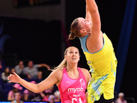 Lucy Austin of Australia and Martina Salmon of New Zealand compete in the Fast5 Netball World Series match between New Zealand and Australia...