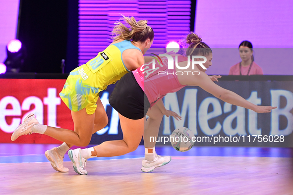 Kim Jenner of Australia and Paris Lokotui of New Zealand compete in the Fast5 Netball World Series match between New Zealand and Australia a...