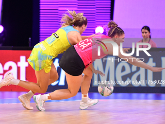 Kim Jenner of Australia and Paris Lokotui of New Zealand compete in the Fast5 Netball World Series match between New Zealand and Australia a...