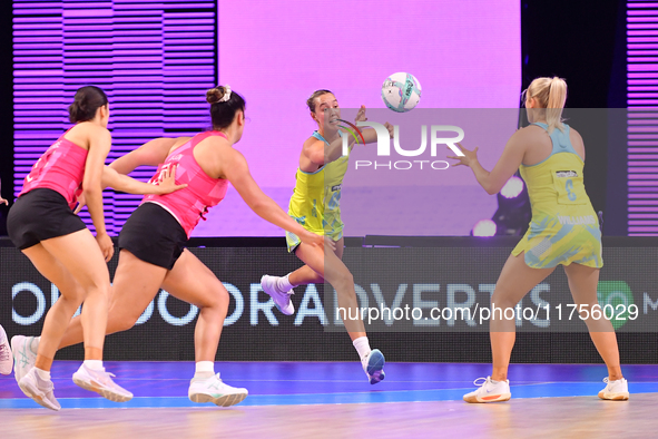 Teigan O'Shannassy of Australia (C) competes in the Fast5 Netball World Series match between New Zealand and Australia at the Wolfbrook Aren...