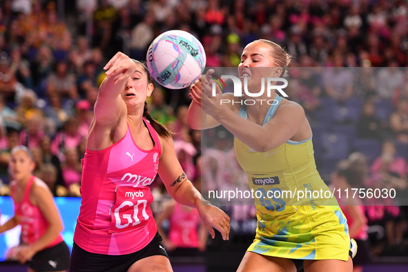 Matissa Letherbarrow of Australia (R) and Kate Burley compete in the Fast5 Netball World Series match between New Zealand and Australia at t...