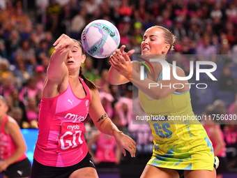 Matissa Letherbarrow of Australia (R) and Kate Burley compete in the Fast5 Netball World Series match between New Zealand and Australia at t...