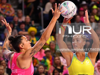 Matissa Letherbarrow of Australia and Erena Mikaere of New Zealand compete in the Fast5 Netball World Series match between New Zealand and A...