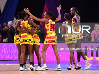 Members of the Uganda team celebrate the win against England during the Fast5 Netball World Series match between England and Uganda at the W...