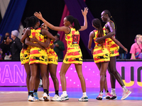 Members of the Uganda team celebrate the win against England during the Fast5 Netball World Series match between England and Uganda at the W...