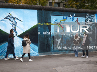  People visit East Side Gallery a day ahead of the 35th anniversary of the fall of the Berlin Wall. Berlin, Germany on 8 November, 2024. (