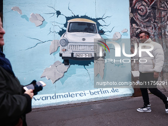  People visit East Side Gallery a day ahead of the 35th anniversary of the fall of the Berlin Wall. Berlin, Germany on 8 November, 2024. (