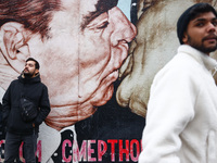  Iconic 'Kiss' mural East Side Gallery a day ahead of the 35th anniversary of the fall of the Berlin Wall. Berlin, Germany on 8 November, 20...