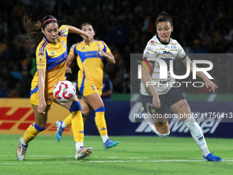 Stephanie Ribeiro #7 of Pumas Femenil and Greta Espinoza #4 of Tigres Femenil fight for the ball during the quarterfinals, first leg, of the...