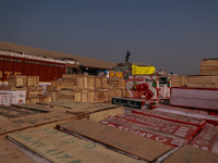 Wooden boxes filled with fresh apples are kept at Asia's second-largest fruit market for sale in Sopore, Jammu and Kashmir, India, on Novemb...