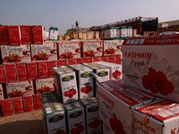 Labourers load apple boxes onto trucks, which are sent to different parts of the country from Asia's second-largest fruit mandi in Sopore, J...