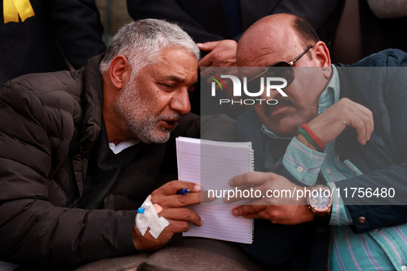 Deputy Chief Minister Surinder Kumar Choudhary talks with MLA Sopore Irshad Rasool Kar during a program at Asia's 2nd Largest Fruit Mandi in...