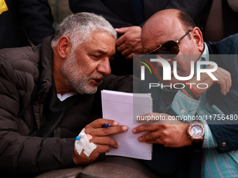 Deputy Chief Minister Surinder Kumar Choudhary talks with MLA Sopore Irshad Rasool Kar during a program at Asia's 2nd Largest Fruit Mandi in...