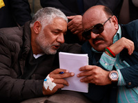 Deputy Chief Minister Surinder Kumar Choudhary talks with MLA Sopore Irshad Rasool Kar during a program at Asia's 2nd Largest Fruit Mandi in...