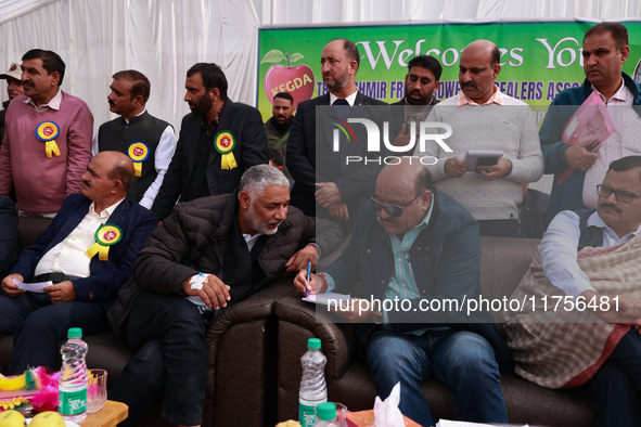 Deputy Chief Minister Surinder Kumar Choudhary talks with MLA Sopore Irshad Rasool Kar during a program at Asia's 2nd Largest Fruit Mandi in...