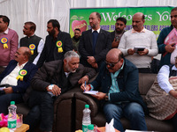 Deputy Chief Minister Surinder Kumar Choudhary talks with MLA Sopore Irshad Rasool Kar during a program at Asia's 2nd Largest Fruit Mandi in...