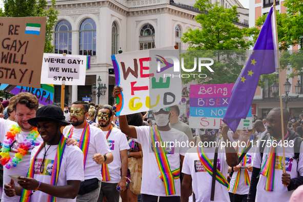 A group of Black refugees marches during Christopher Street Day (CSD) in Munich, Germany, on June 22, 2024, holding colorful signs advocatin...