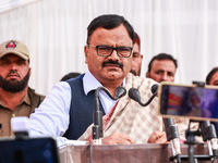 National Conference senior leader and Minister Javed Ahmad Rana speaks during a program at Asia's second largest fruit market in Sopore, Jam...