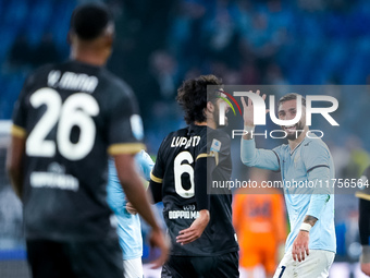 Taty Castellanos of SS Lazio greets  Yerry Mina of Cagliari Calcio as he leaves the pitch receiving a red card during the Serie A Enilive ma...