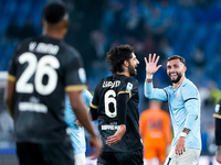 Taty Castellanos of SS Lazio greets  Yerry Mina of Cagliari Calcio as he leaves the pitch receiving a red card during the Serie A Enilive ma...