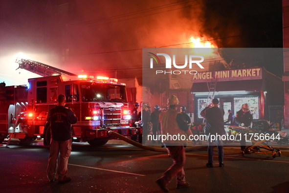 Flames erupt from multiple stores on John F. Kennedy Boulevard and reach 4-alarms as firefighters continue to battle numerous fires around t...