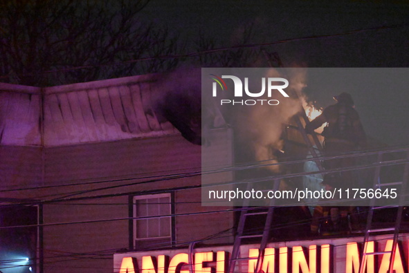 Flames erupt from multiple stores on John F. Kennedy Boulevard and reach 4-alarms as firefighters continue to battle numerous fires around t...