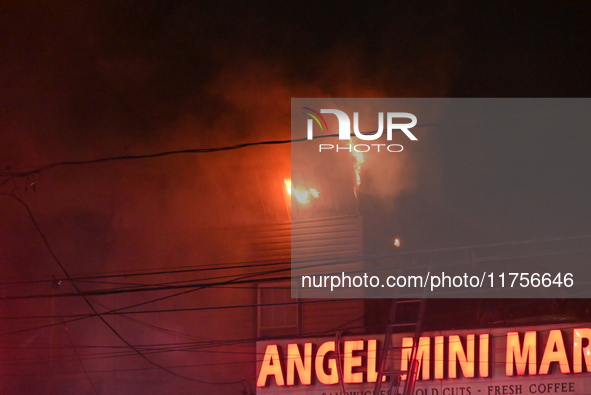 Flames erupt from multiple stores on John F. Kennedy Boulevard and reach 4-alarms as firefighters continue to battle numerous fires around t...