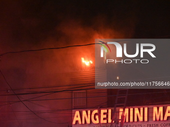 Flames erupt from multiple stores on John F. Kennedy Boulevard and reach 4-alarms as firefighters continue to battle numerous fires around t...