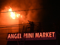 Flames erupt from multiple stores on John F. Kennedy Boulevard and reach 4-alarms as firefighters continue to battle numerous fires around t...