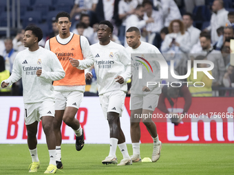 Rodrygo Goes, Jude Bellingham, Vinicius Jr, and Kylian Mbappe of Real Madrid warm up during the La Liga 2024/25 match between Real Madrid an...