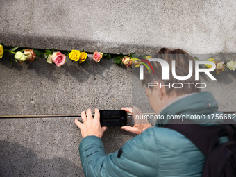 Flowers at Berlin Wall Memorial after the commemoration ceremony marking the 35th anniversary of the fall of the Berlin Wall. Berlin, German...